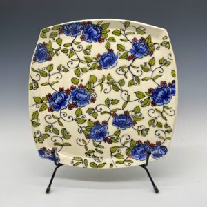 Hand-painted blue peony porcelain square plate with embossed floral design – front view.