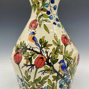 Hand painted porcelain vase with red poppies, green leaves, blue berries, and two bluebirds on branches