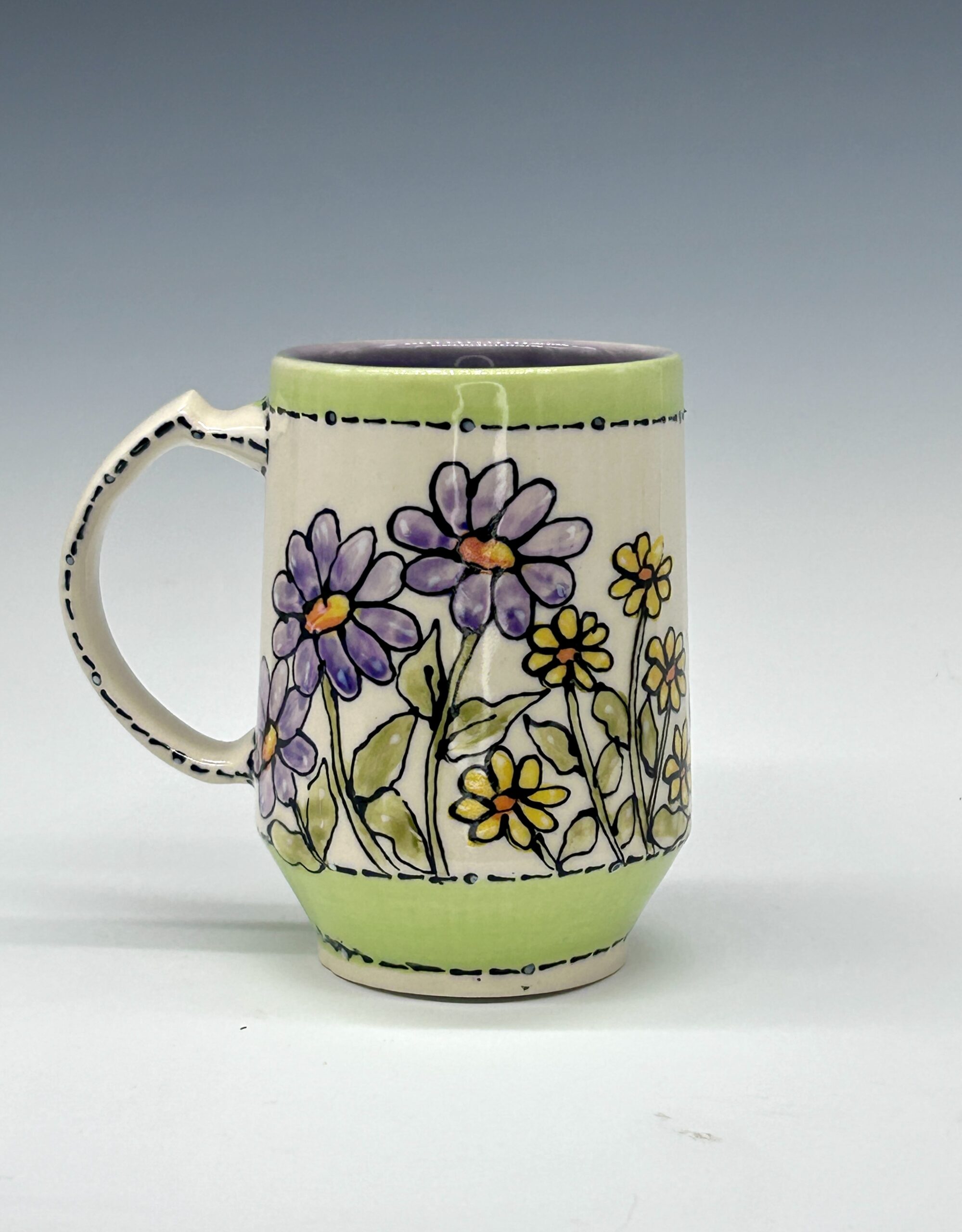 Hand-painted ceramic mug featuring an orange and black butterfly among purple flowers with green accents, view 2