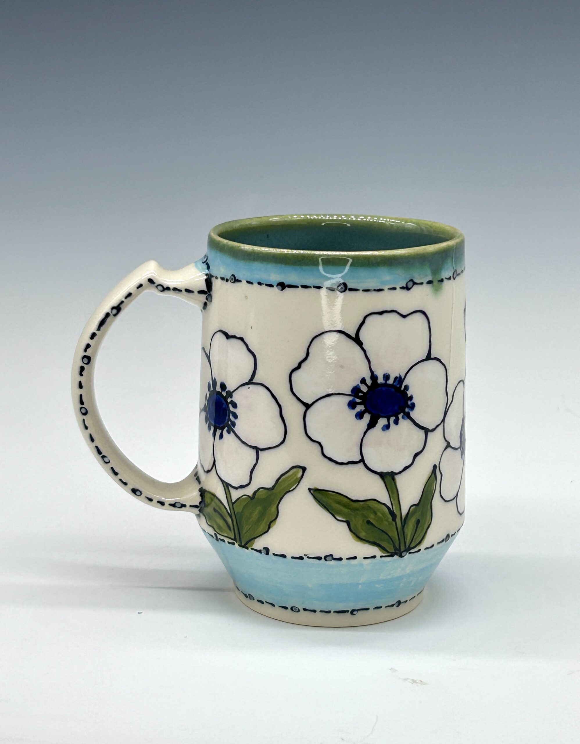 Hand-painted ceramic mug featuring a red cardinal among white flowers with turquoise accents, view 2