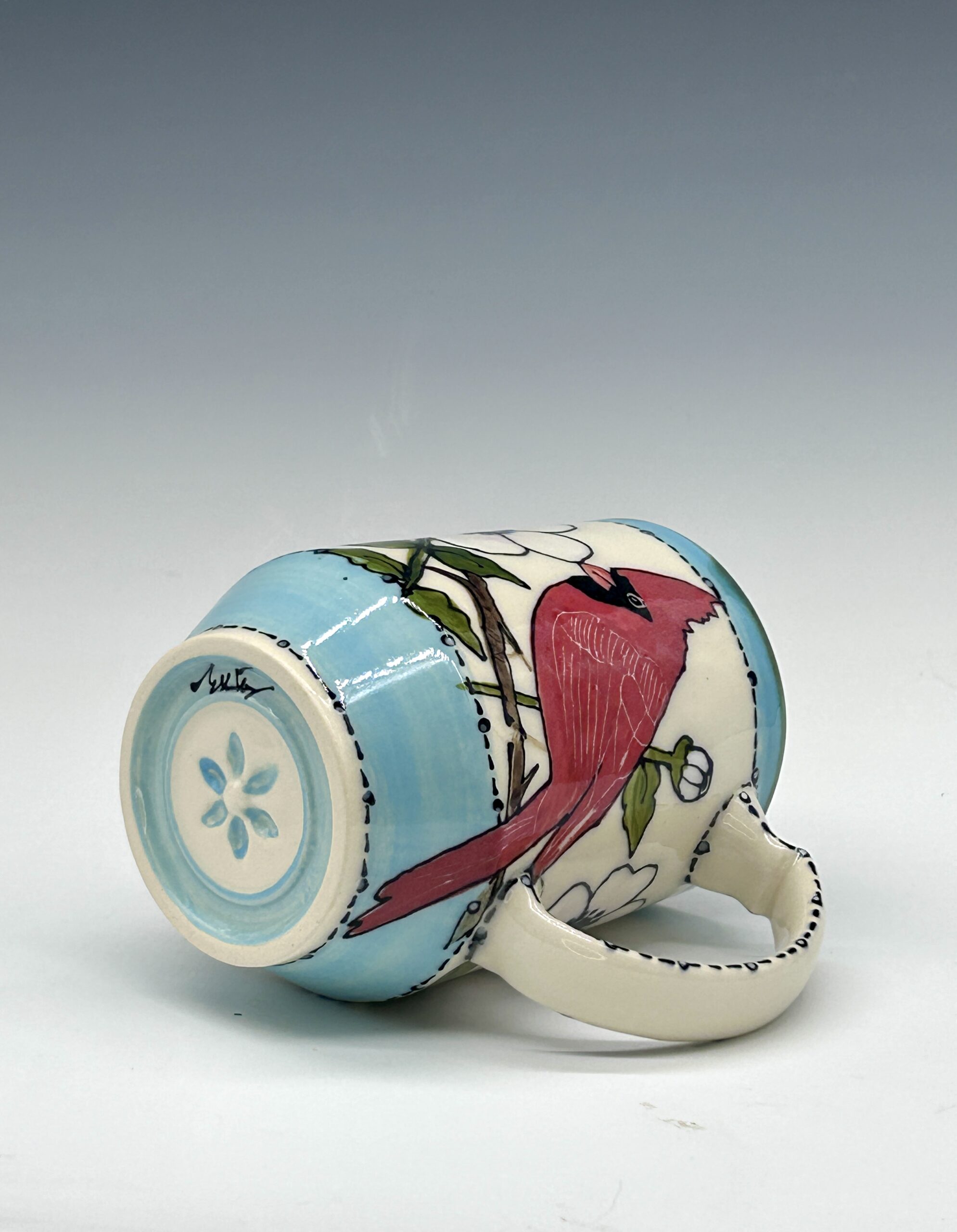 Hand-painted ceramic mug featuring a red cardinal among white flowers with turquoise accents, view 4