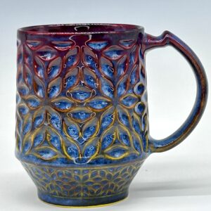 Petal Lattice geometric ceramic mug in blue, burgundy and golden ochre, view 0